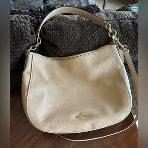 Coach tan leather handbag. Gently used in very good condition.